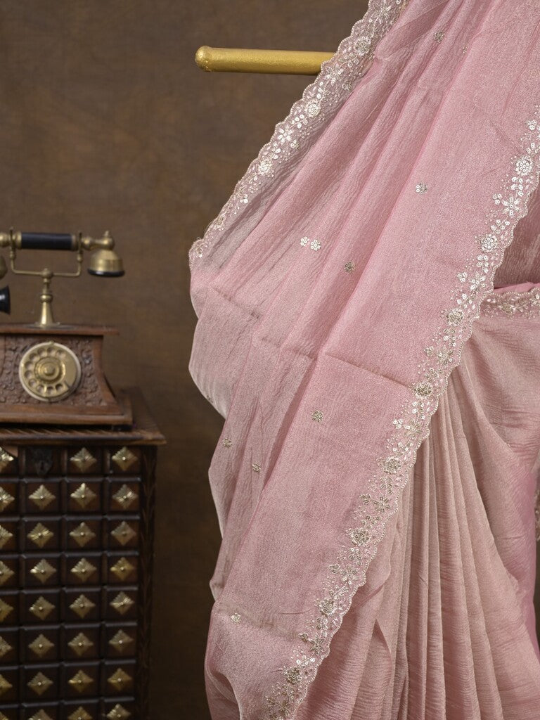Tissue crush fancy saree light pink color allover motifs & embroidery border with running pallu and printed blouse