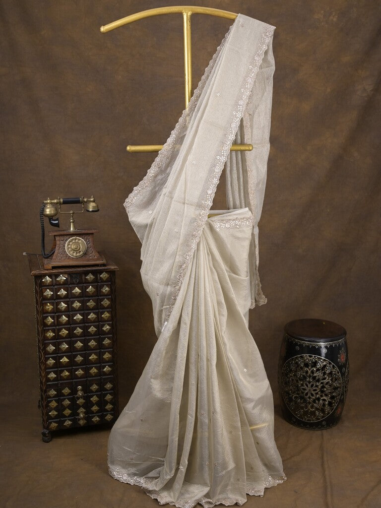 Tissue crush fancy saree light grey color allover motifs & embroidery border with running pallu and printed blouse