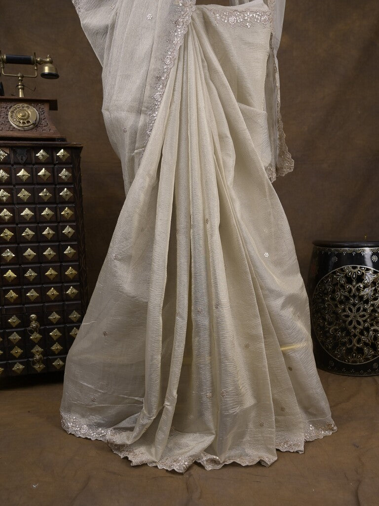 Tissue crush fancy saree light grey color allover motifs & embroidery border with running pallu and printed blouse