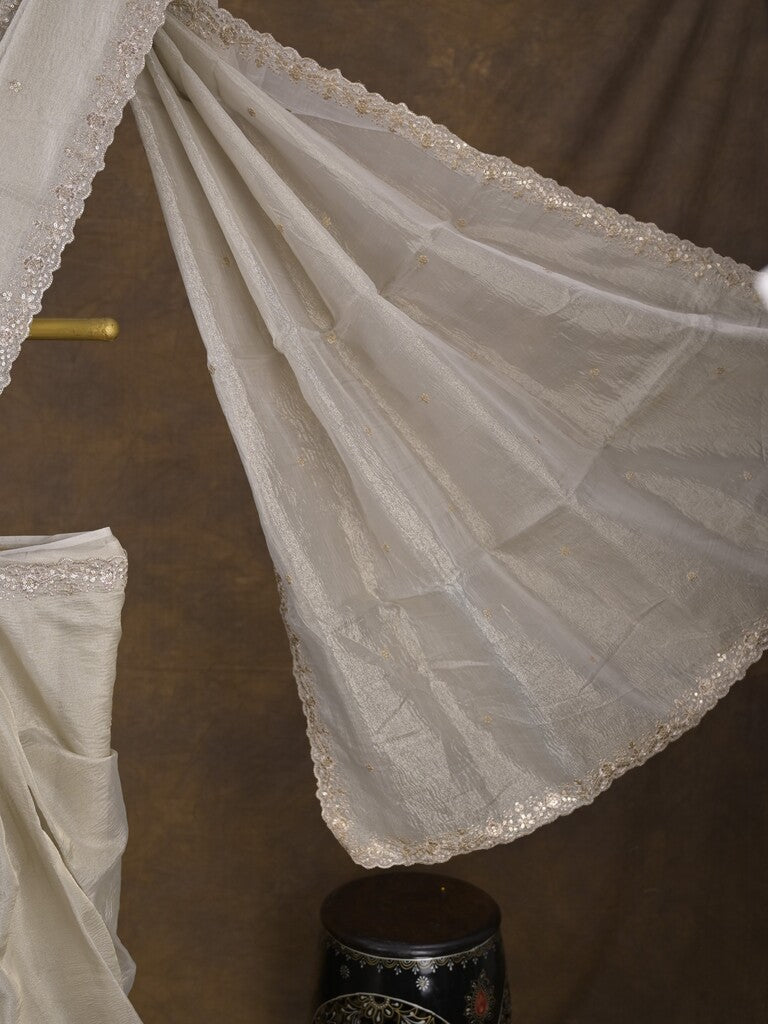 Tissue crush fancy saree light grey color allover motifs & embroidery border with running pallu and printed blouse