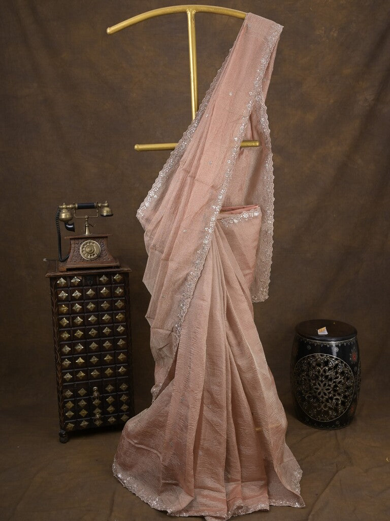 Tissue crush fancy saree light peach color allover motifs & embroidery border with running pallu and printed blouse