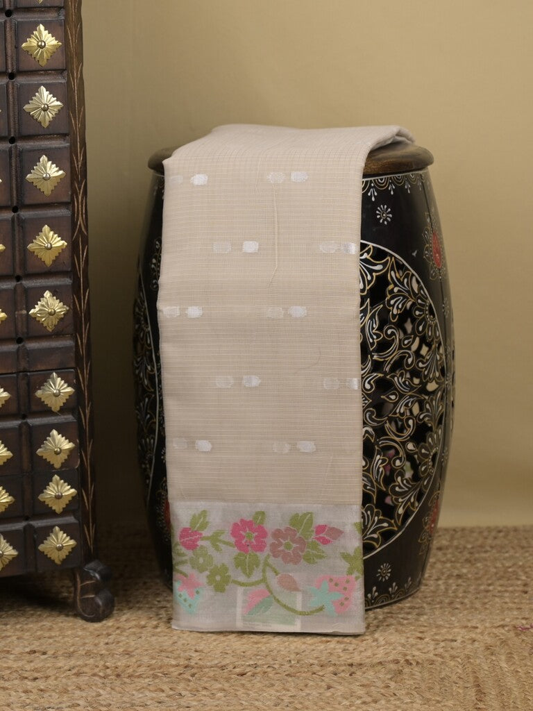 Kota fancy sarees in light beige color allover motifs with zari border and matching blouse