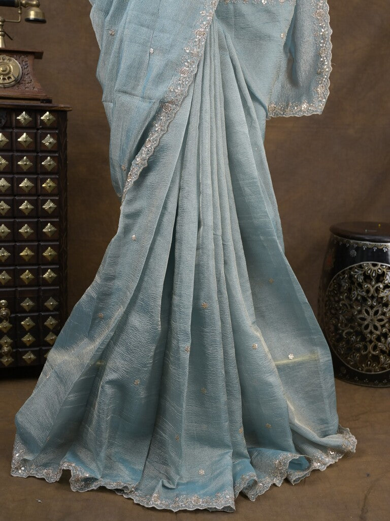 Tissue crush fancy saree light blue color allover motifs & embroidery border with running pallu and printed blouse