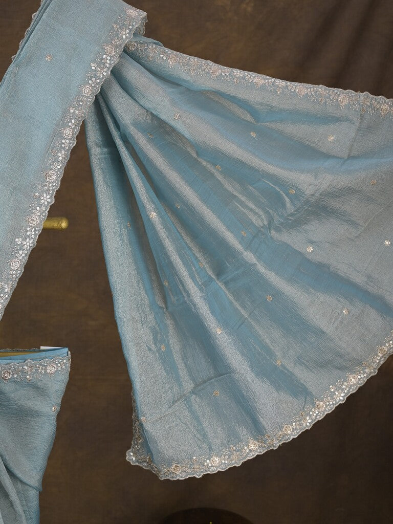Tissue crush fancy saree light blue color allover motifs & embroidery border with running pallu and printed blouse