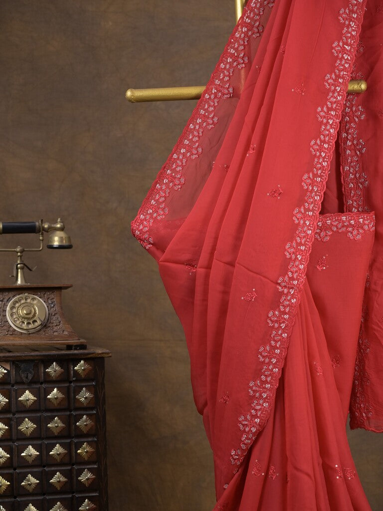 Organza fancy saree red color allover embroidered motifs & cutwork border with running pallu and self blouse
