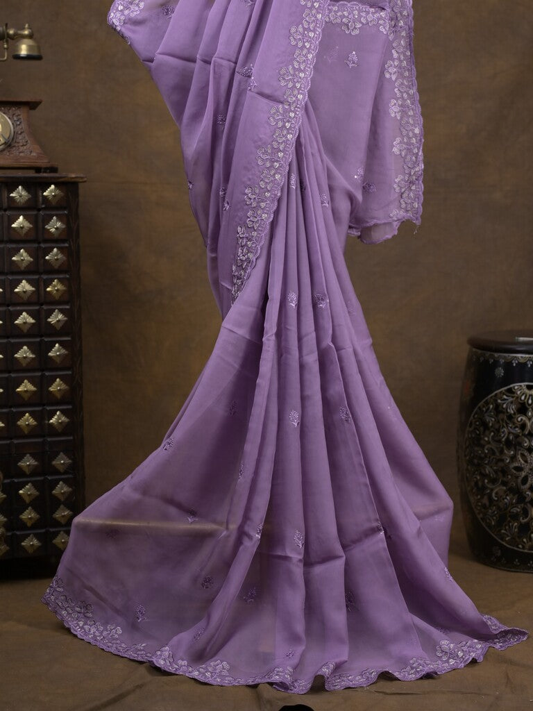 Organza fancy saree lavender color allover embroidered motifs & cutwork border with running pallu and self blouse