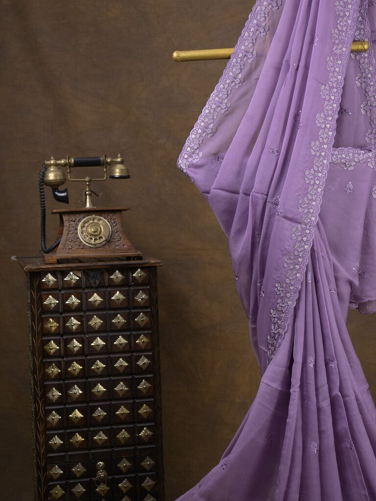 Organza fancy saree lavender color allover embroidered motifs & cutwork border with running pallu and self blouse