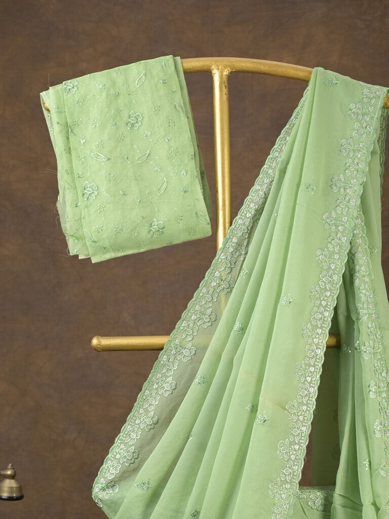 Organza fancy saree light pista green color allover embroidered motifs & cutwork border with running pallu and self blouse