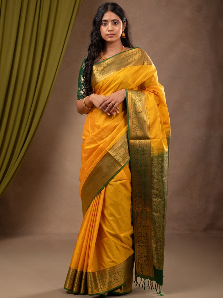 Kanchi pattu saree golden yellow color allover zari motifs & zari border with rich pallu and contrast plain blouse