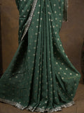 Chinnon fancy saree dark green color allover motifs & embroidery border with running pallu and contrast blouse