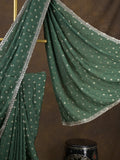 Chinnon fancy saree dark green color allover motifs & embroidery border with running pallu and contrast blouse