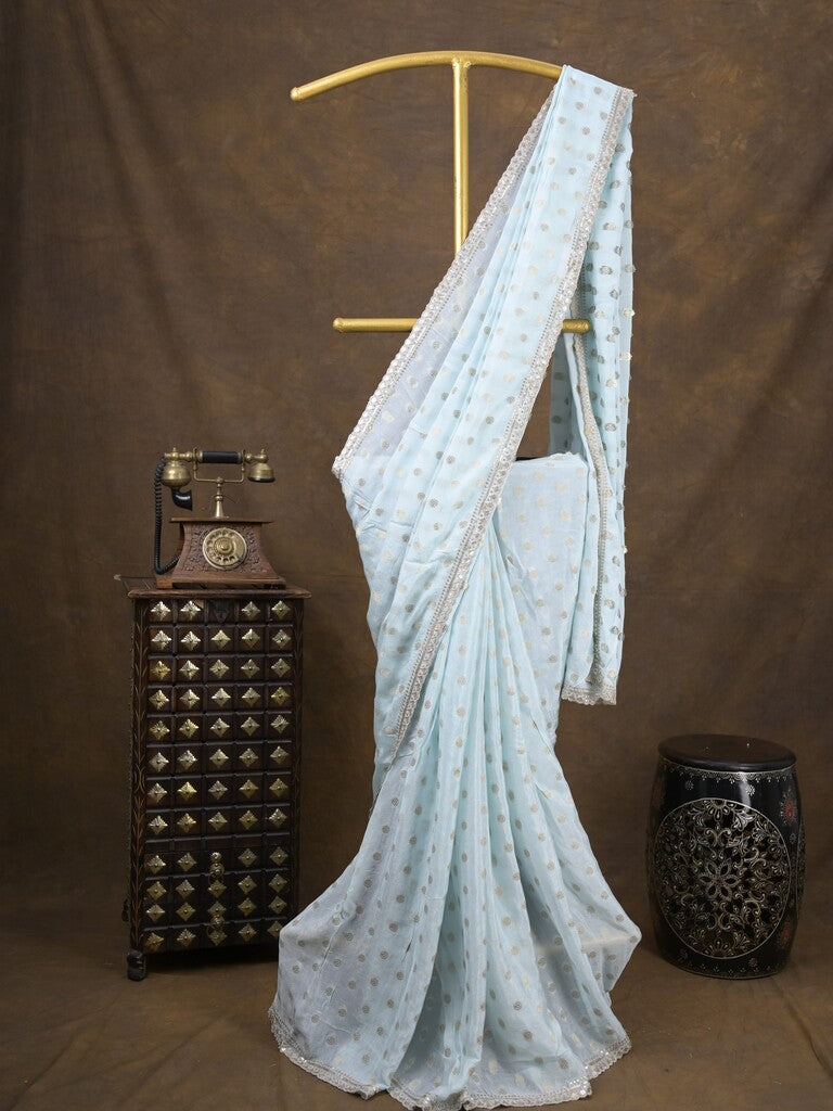 Chinnon fancy saree pastel blue color allover motifs & embroidery border with running pallu and contrast blouse