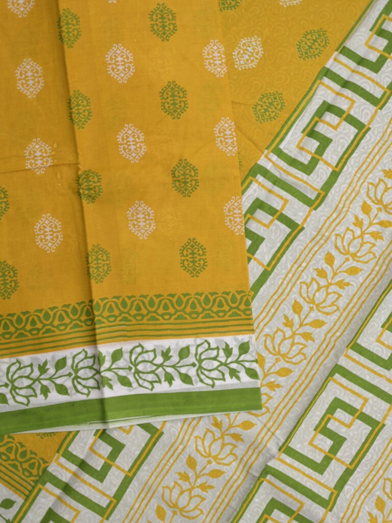 Printed cotton saree in yellow color with contrast border and attached printed blouse