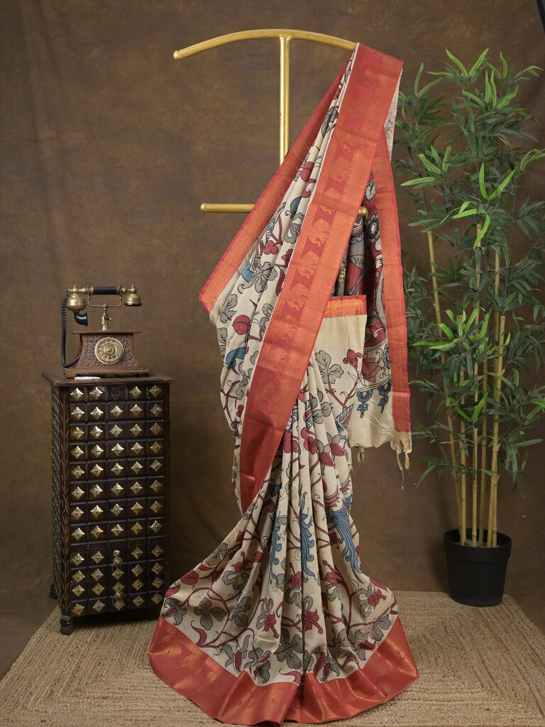 Pen kalamkari pattu cream color floral painted saree with contrast zari border and printed pallu & attached blouse