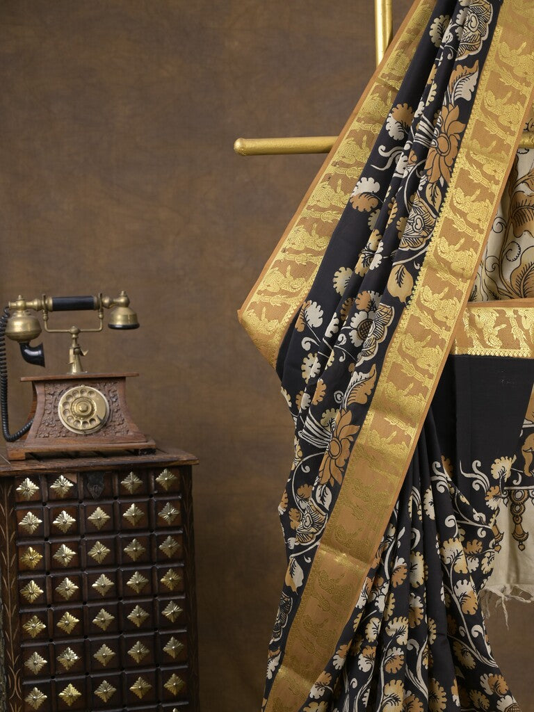 Pen kalamkari pattu black color floral painted saree with contrast zari border and printed pallu & attached blouse