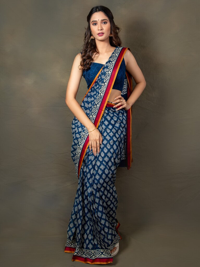 Blue color mul cotton one minute saree with allover prints & contrast border and attached printed blouse