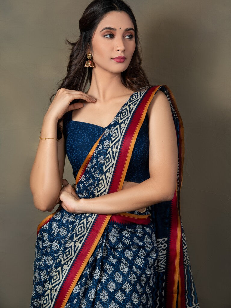 Blue color mul cotton one minute saree with allover prints & contrast border and attached printed blouse