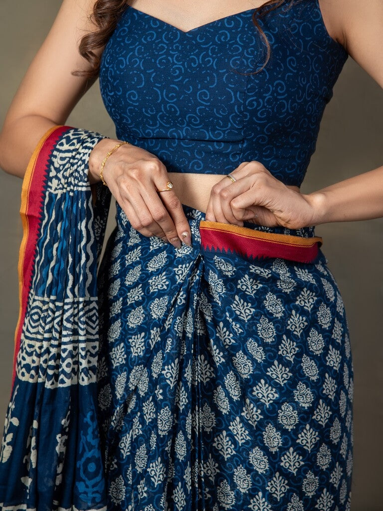 Blue color mul cotton one minute saree with allover prints & contrast border and attached printed blouse