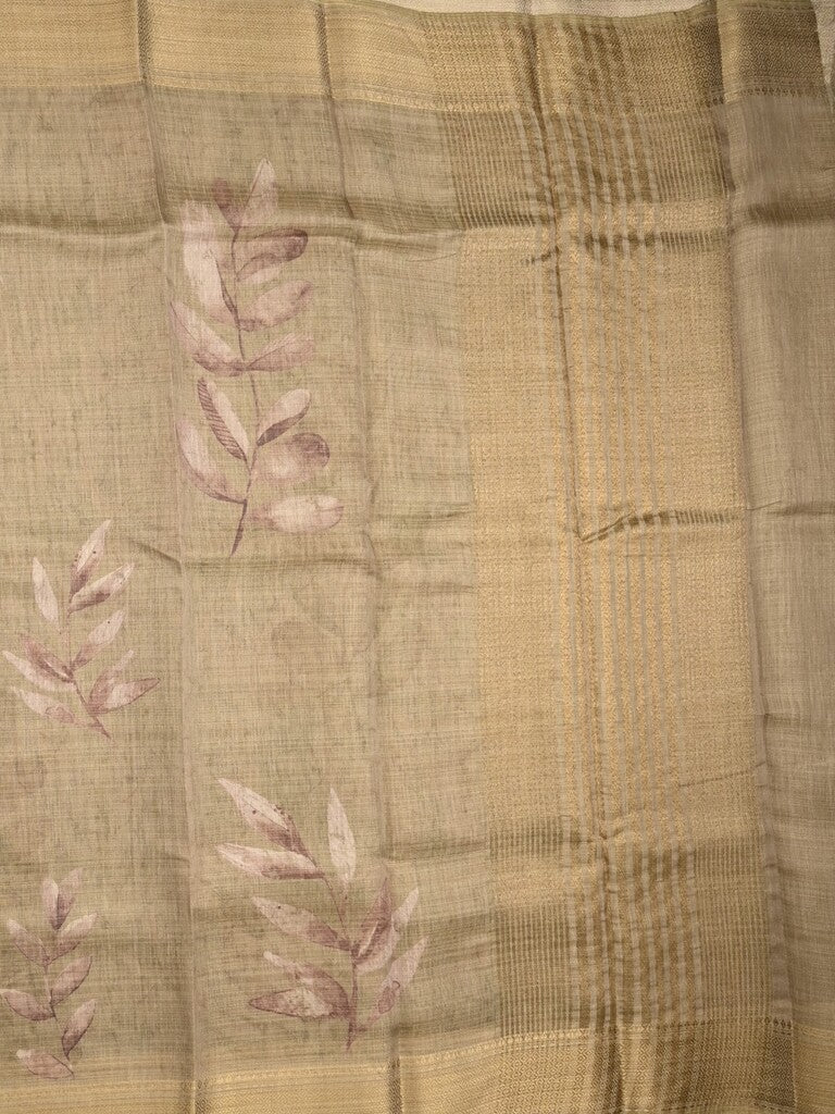 Jute tissue fancy saree snuff color allover prints & zari border with short pallu and plain blouse