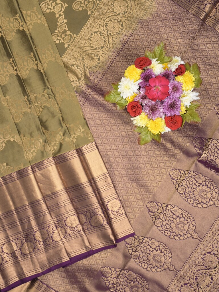 Kanchi pattu saree light olive green color allover zari weaves & zari border with rich pallu and contrast plain blouse