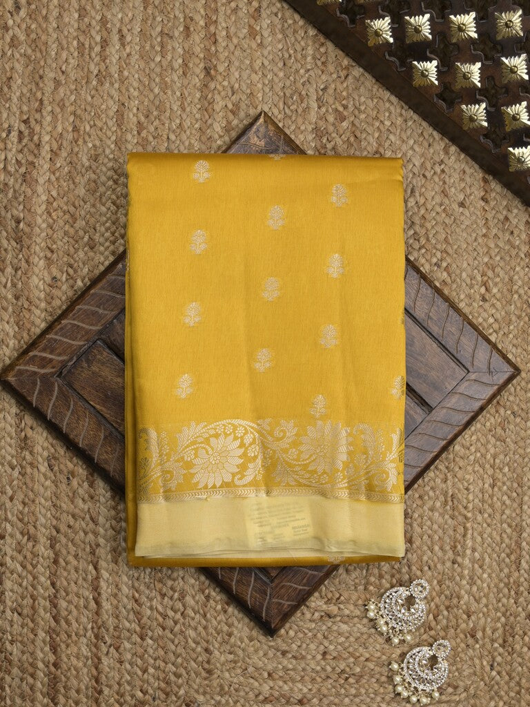 Green mango fancy sarees with allover zari detailing and attached contrast blouse