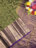 Kanchi pattu saree olive green color allover zari weaves & zari border with rich pallu and contrast plain blouse