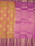 Kanchi pattu saree pinkish orange color allover zari motifs & zari border with rich pallu and contrast plain blouse