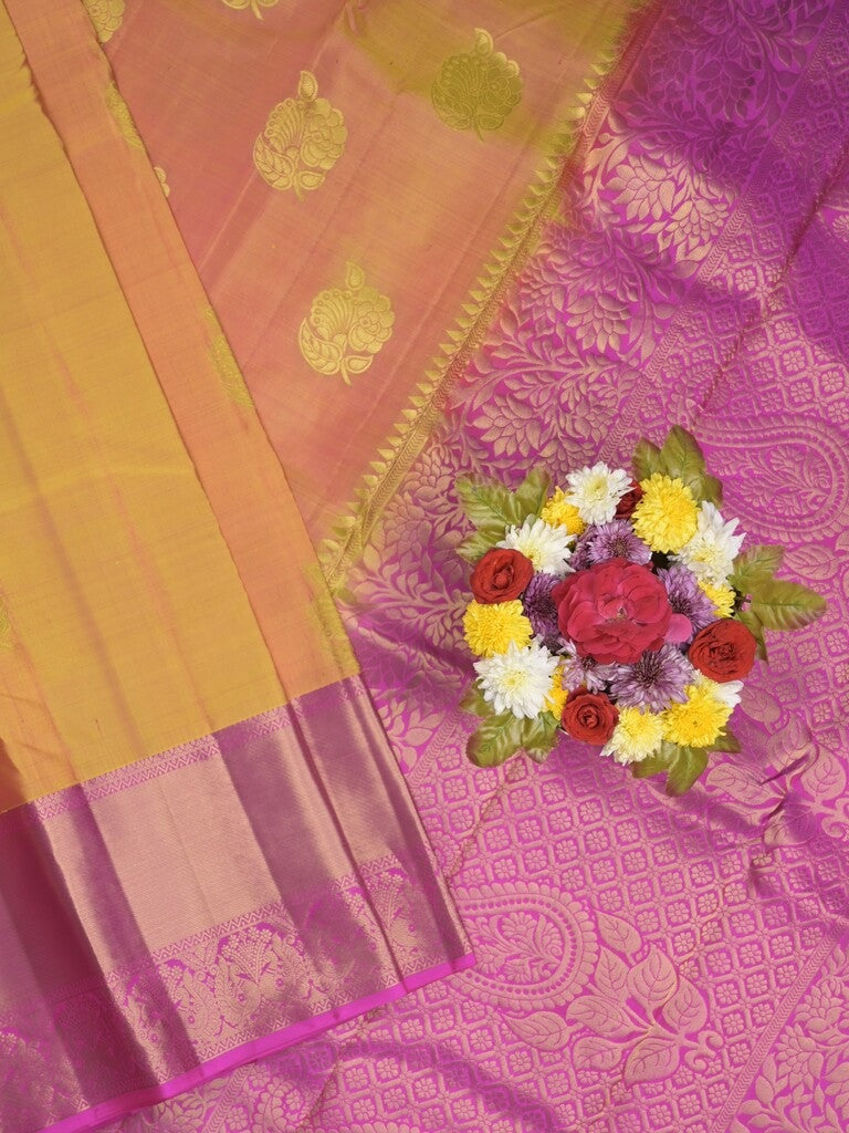 Kanchi pattu saree pinkish orange color allover zari motifs & zari border with rich pallu and contrast plain blouse
