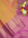Kanchi pattu saree pinkish orange color allover zari motifs & zari border with rich pallu and contrast plain blouse