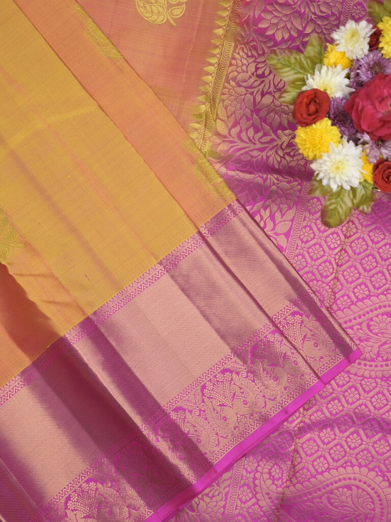 Kanchi pattu saree pinkish orange color allover zari motifs & zari border with rich pallu and contrast plain blouse