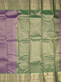 Kanchi pattu saree purple color allover zari weaves & zari border with rich pallu and contrast plain blouse