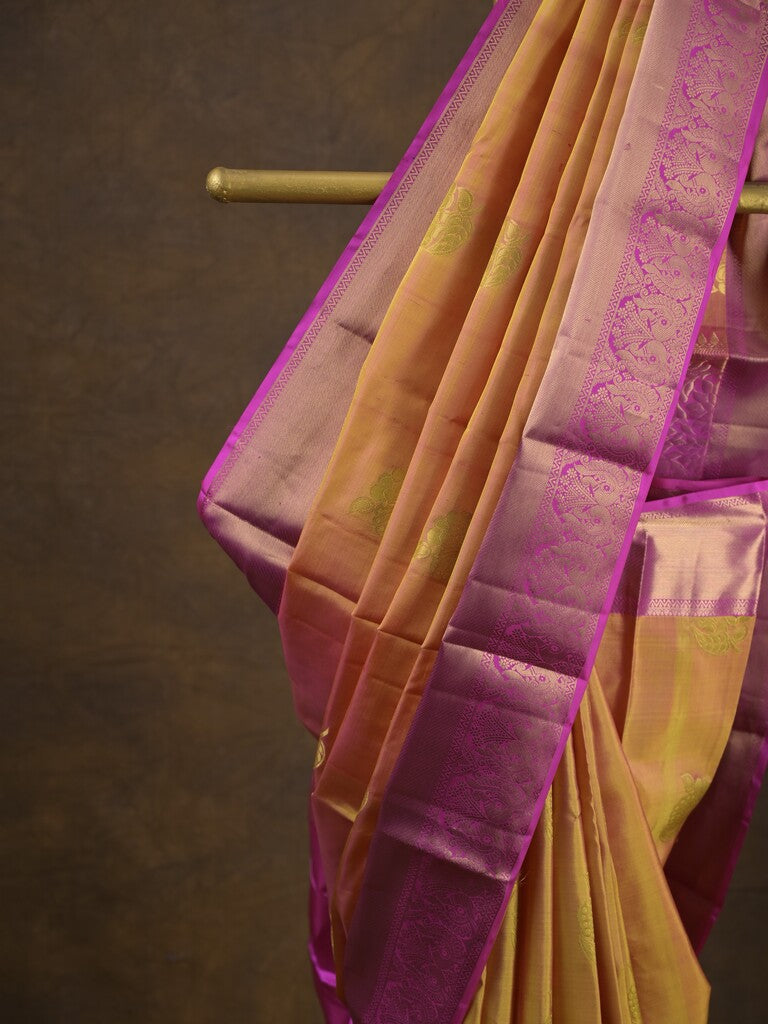 Kanchi pattu saree pinkish orange color allover zari motifs & zari border with rich pallu and contrast plain blouse