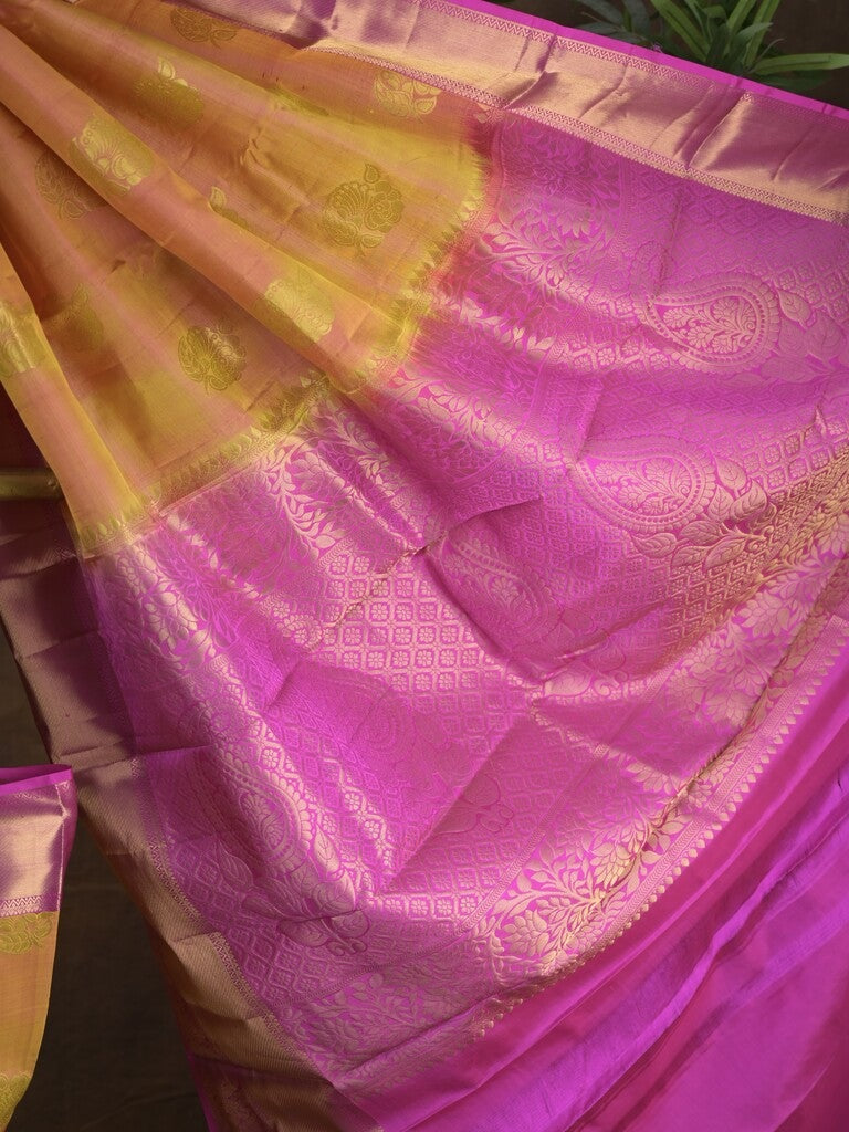 Kanchi pattu saree pinkish orange color allover zari motifs & zari border with rich pallu and contrast plain blouse