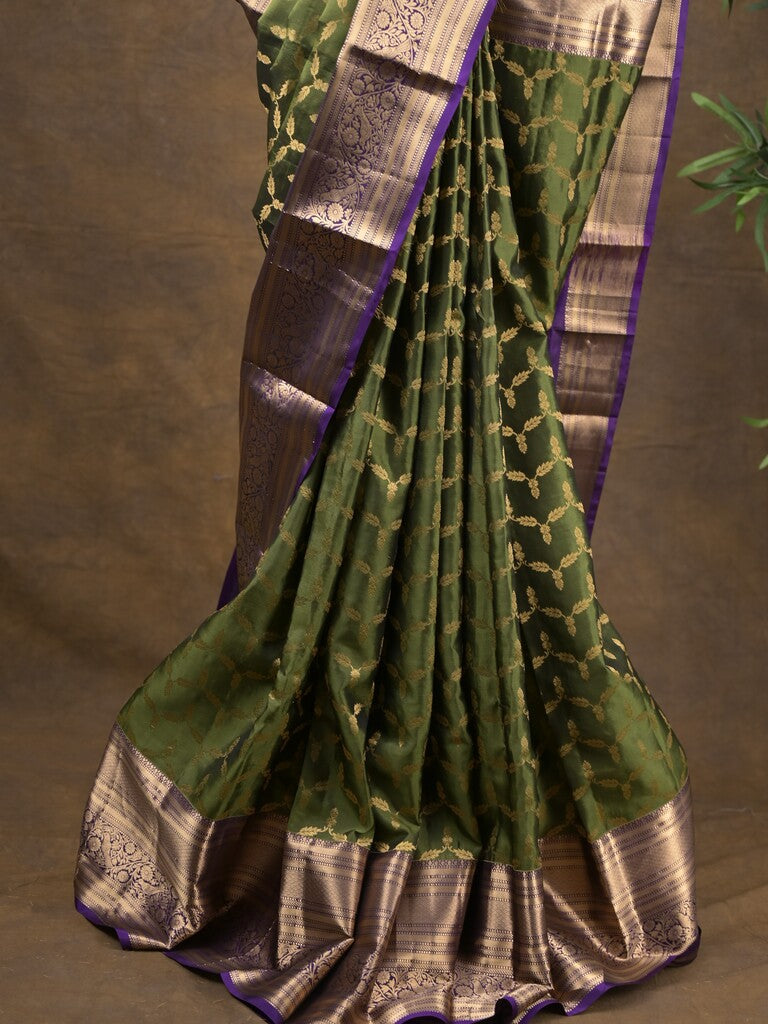 Kanchi pattu saree olive green color allover zari weaves & zari border with rich pallu and contrast plain blouse