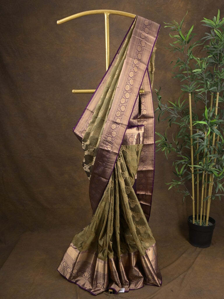 Kanchi pattu saree light olive green color allover zari weaves & zari border with rich pallu and contrast plain blouse