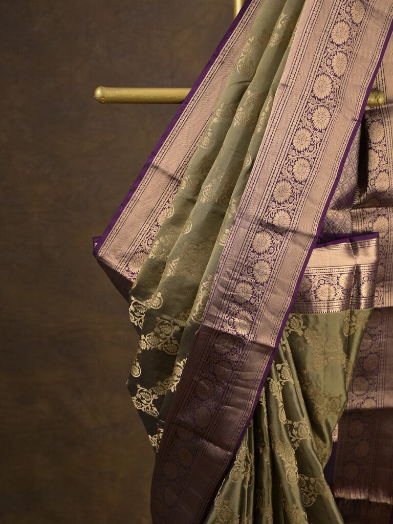 Kanchi pattu saree light olive green color allover zari weaves & zari border with rich pallu and contrast plain blouse