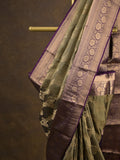 Kanchi pattu saree light olive green color allover zari weaves & zari border with rich pallu and contrast plain blouse