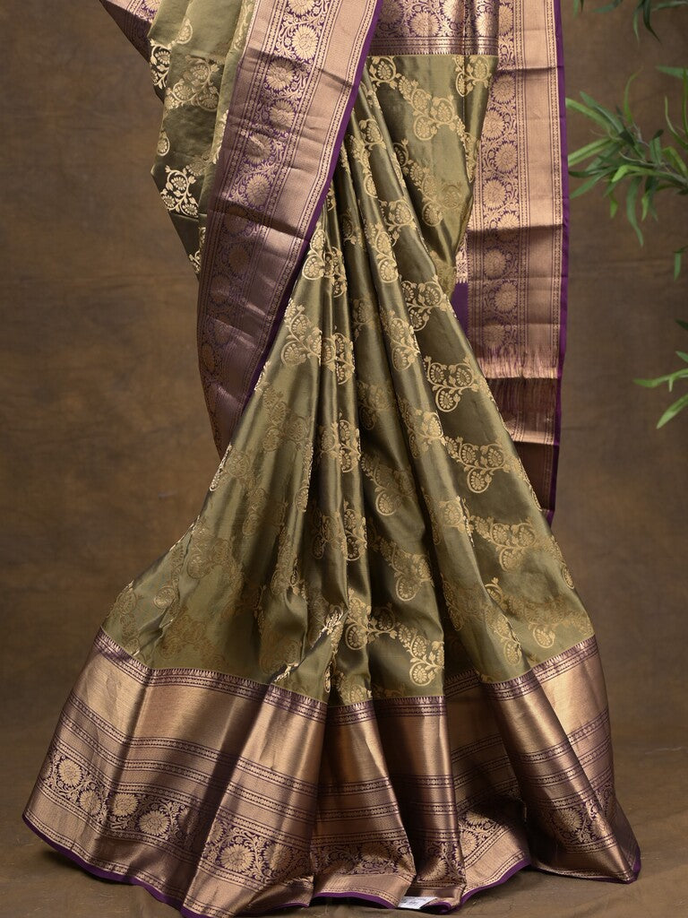 Kanchi pattu saree light olive green color allover zari weaves & zari border with rich pallu and contrast plain blouse