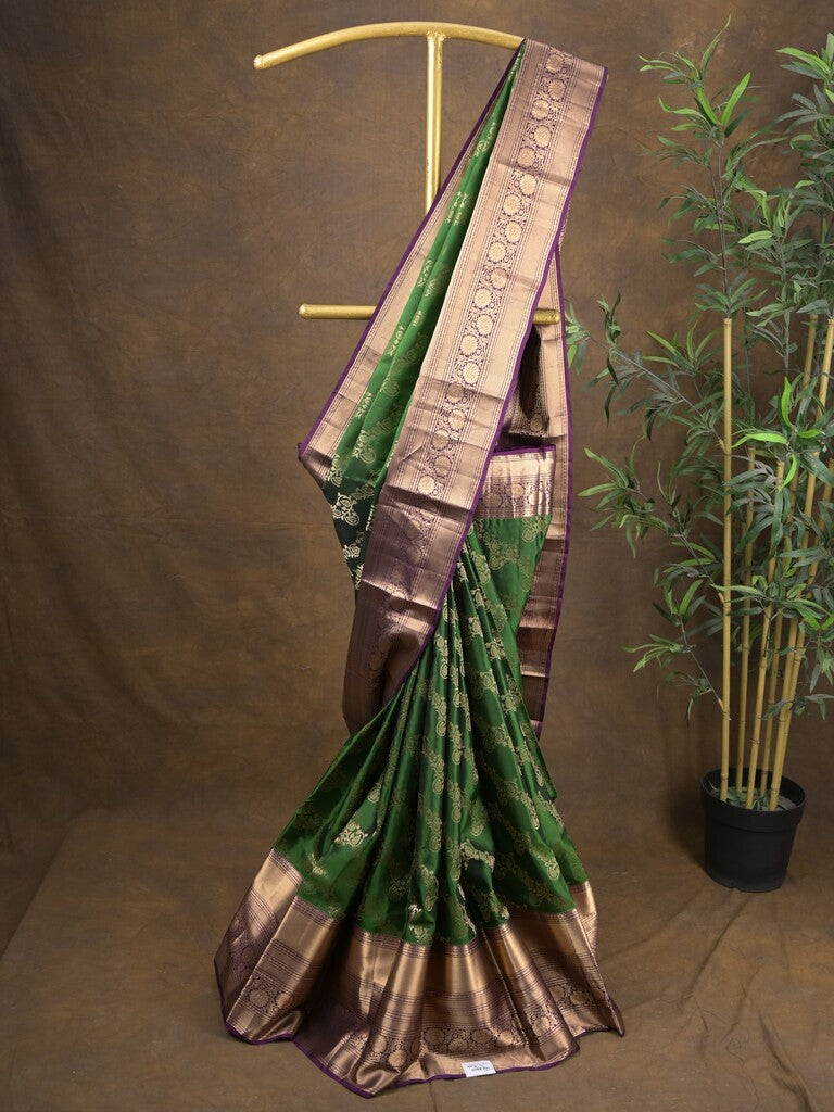 Kanchi pattu saree bottle green color allover zari weaves & zari border with rich pallu and contrast plain blouse