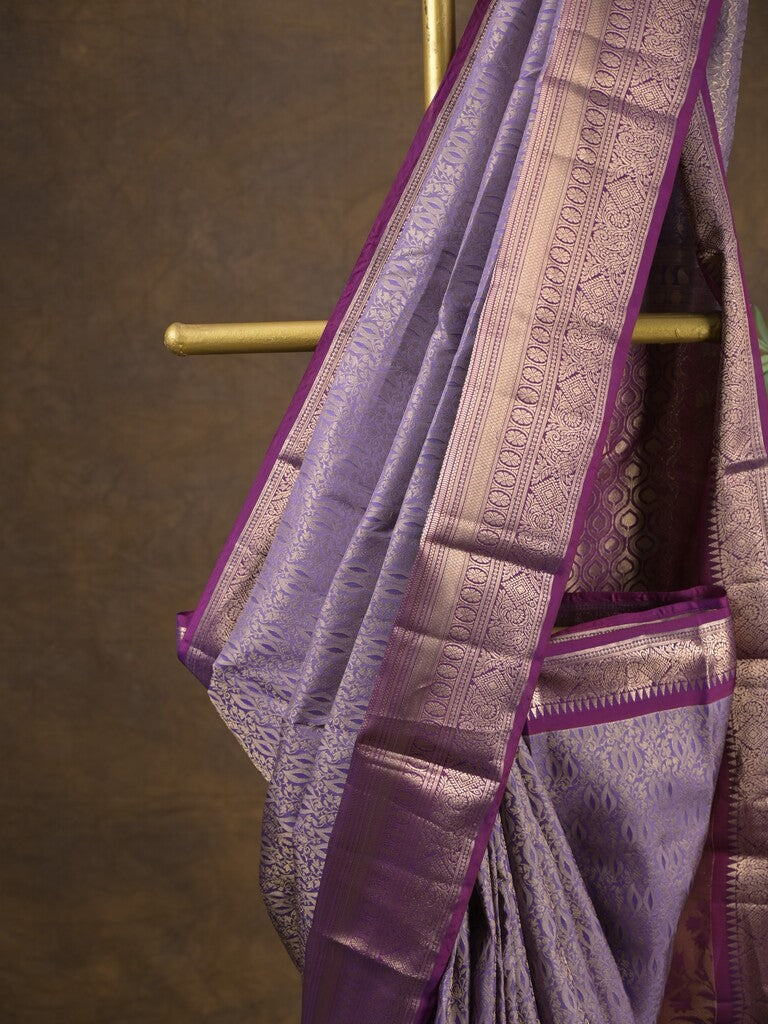 Kanchi pattu saree light purple color allover zari weaves & zari border with rich pallu and contrast plain blouse