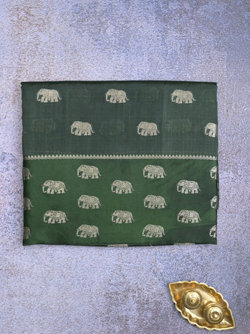 Raw mango fancy saree dark green color allover zari motifs & zari border with brocade pallu and contrast plain blouse