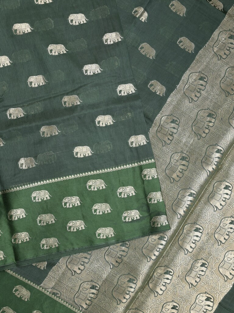 Raw mango fancy saree dark green color allover zari motifs & zari border with brocade pallu and contrast plain blouse