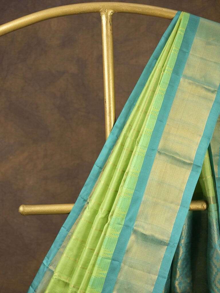 Gadwal pattu saree parrot green color allover zari weaves & kanchi border with rich pallu and contrast plain blouse