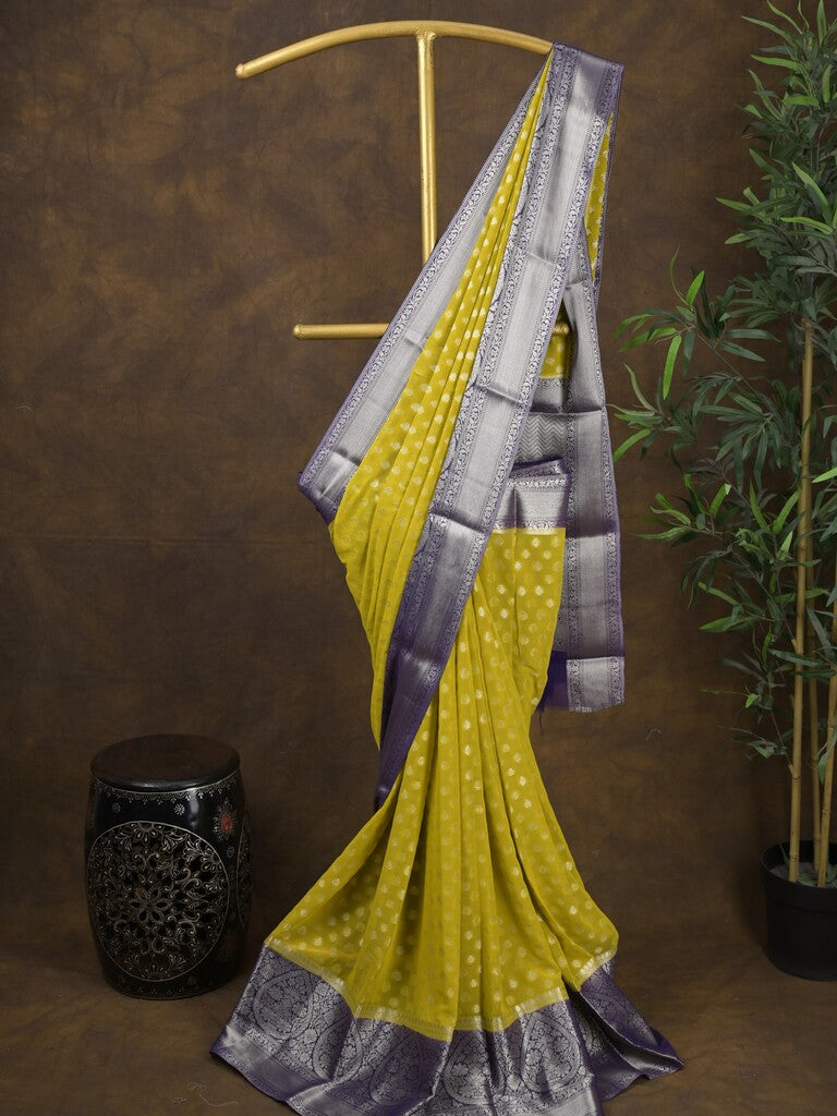 Georgette fancy saree yellow color allover zari motifs & zari border with rich pallu and attached plain blouse
