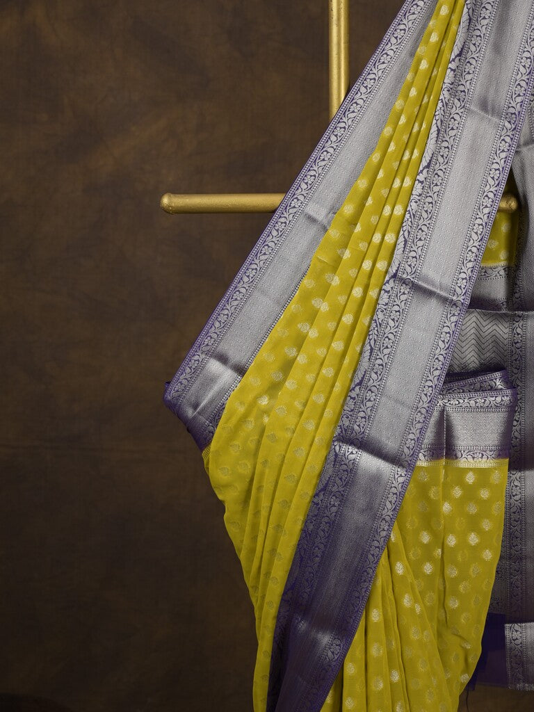 Georgette fancy saree yellow color allover zari motifs & zari border with rich pallu and attached plain blouse