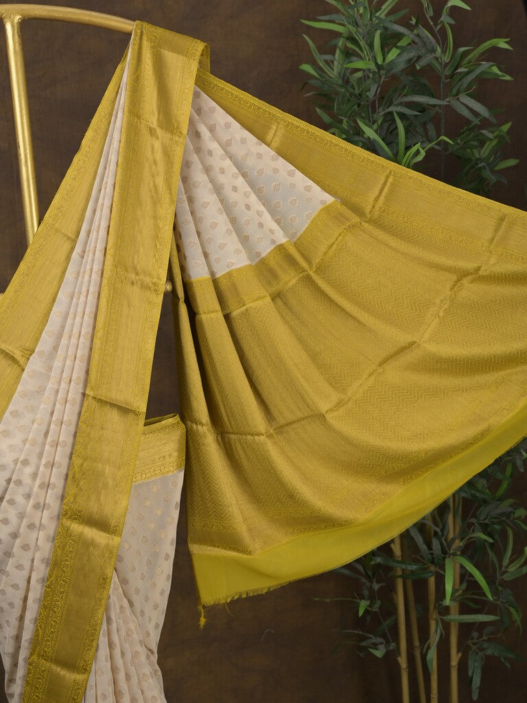 Georgette fancy saree light cream color allover zari motifs & zari border with rich pallu and attached plain blouse