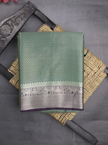 Georgette fancy saree pista green color allover weaves & zari border with rich pallu and plain blouse