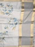 Jute tissue fancy saree light grey color allover prints & small zari border with self pallu and printed blouse