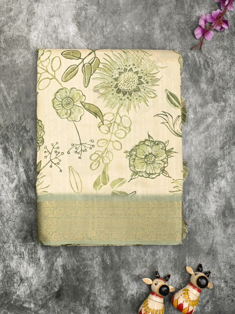 Dola silk fancy saree cream and green color allover prints & zari border with printed pallu and printed blouse
