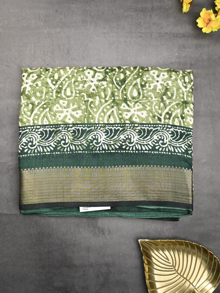 Dola silk fancy saree light green color allover prints & zari border with printed pallu and printed blouse